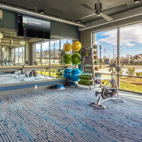 Fitness Center spacious fitness center with equipment and gorgeous views of area through wall-to-wall style windows