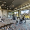 spacious fitness center with views from wall-to-wall style windows