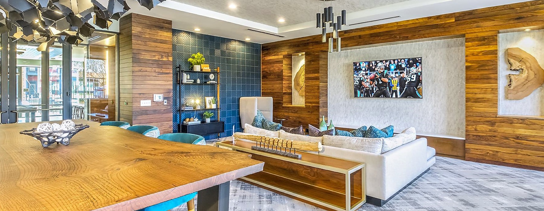 spacious clubroom with ample seating, modern decor & a TV